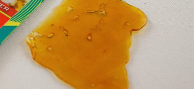 close up picture of a large piece of shatter marijuana concentrate