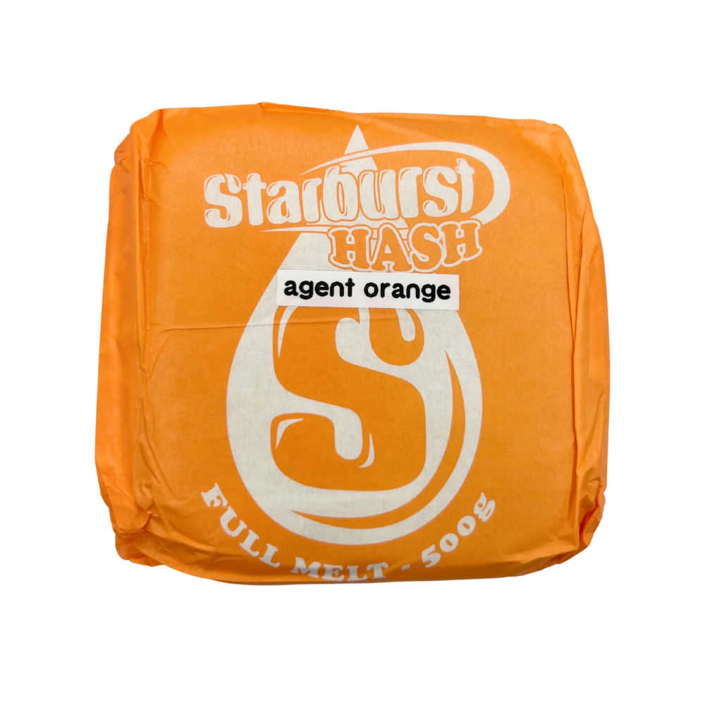 An image of Agent Orange Full Melt Hash with an orange Starburst Wrapper on a white background